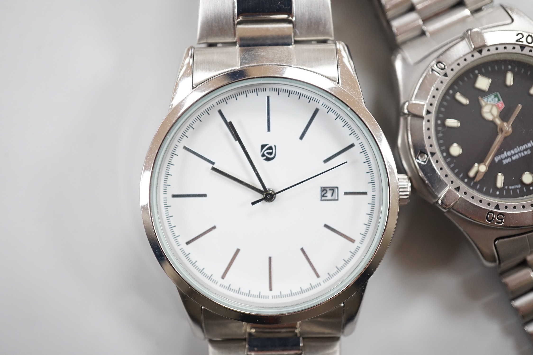 A gentleman's stainless steel Tag Heuer quartz wrist watch, together with a gentleman's stainless steel backed Owim GMBH & Co quartz wrist watch.